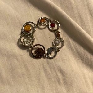 Women bracelet made of gold, silver, rocks, jewels.